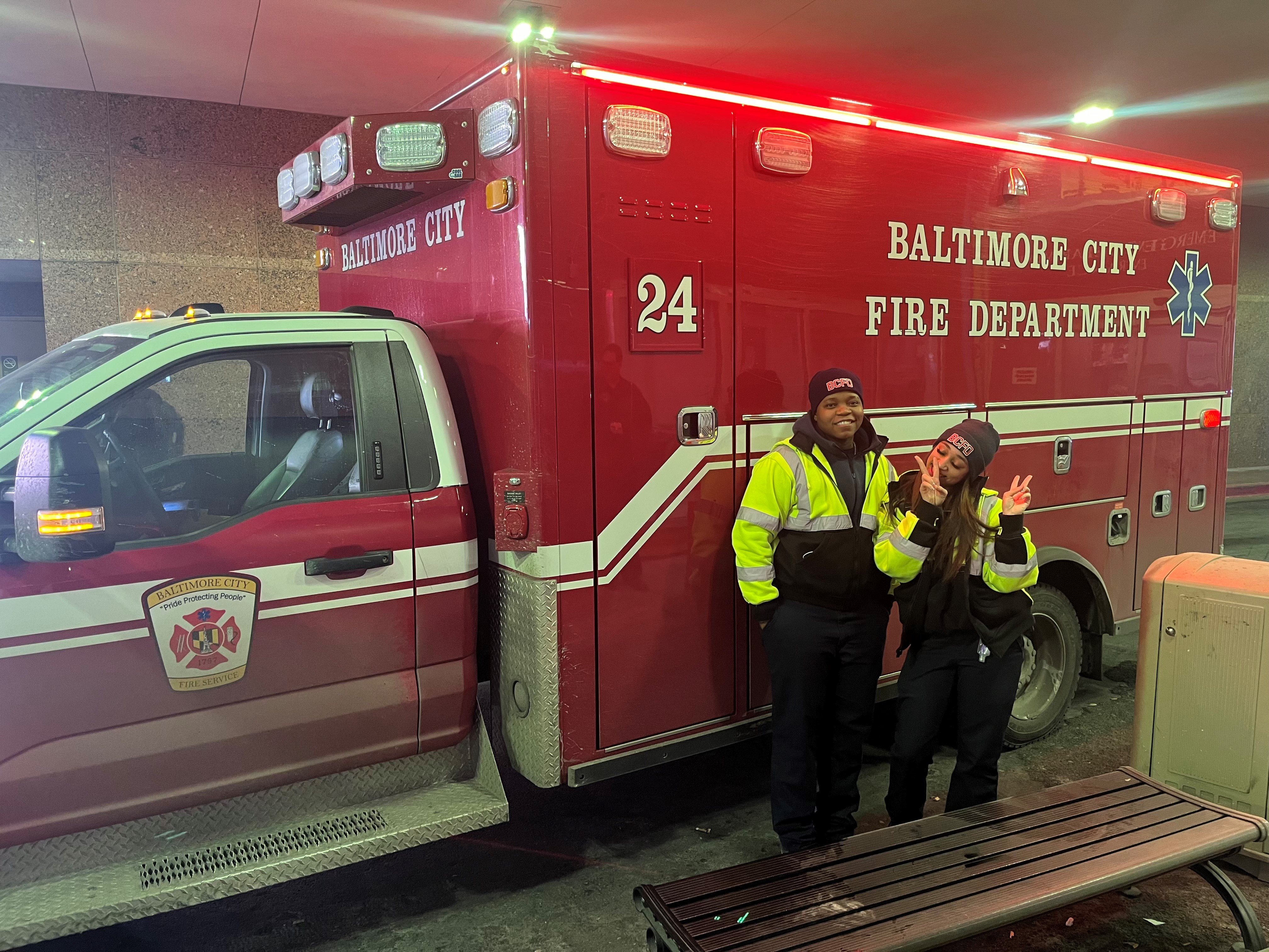 EMS Technicians in front of ambulance